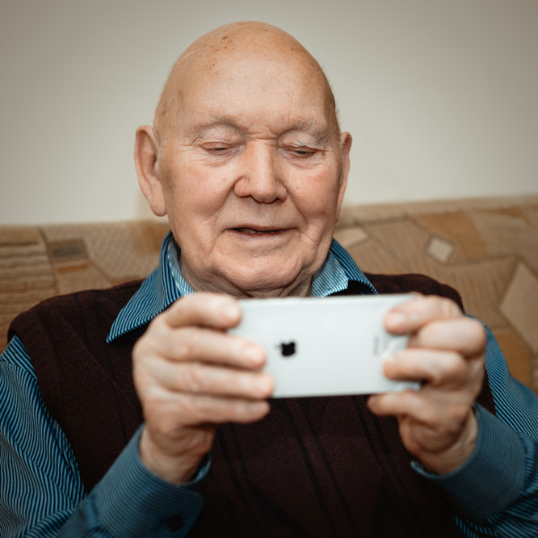 Elderly Person using a phone